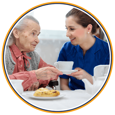Support worker offering tea to an elderly client